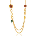Gold necklace with gemstone beads on a white background