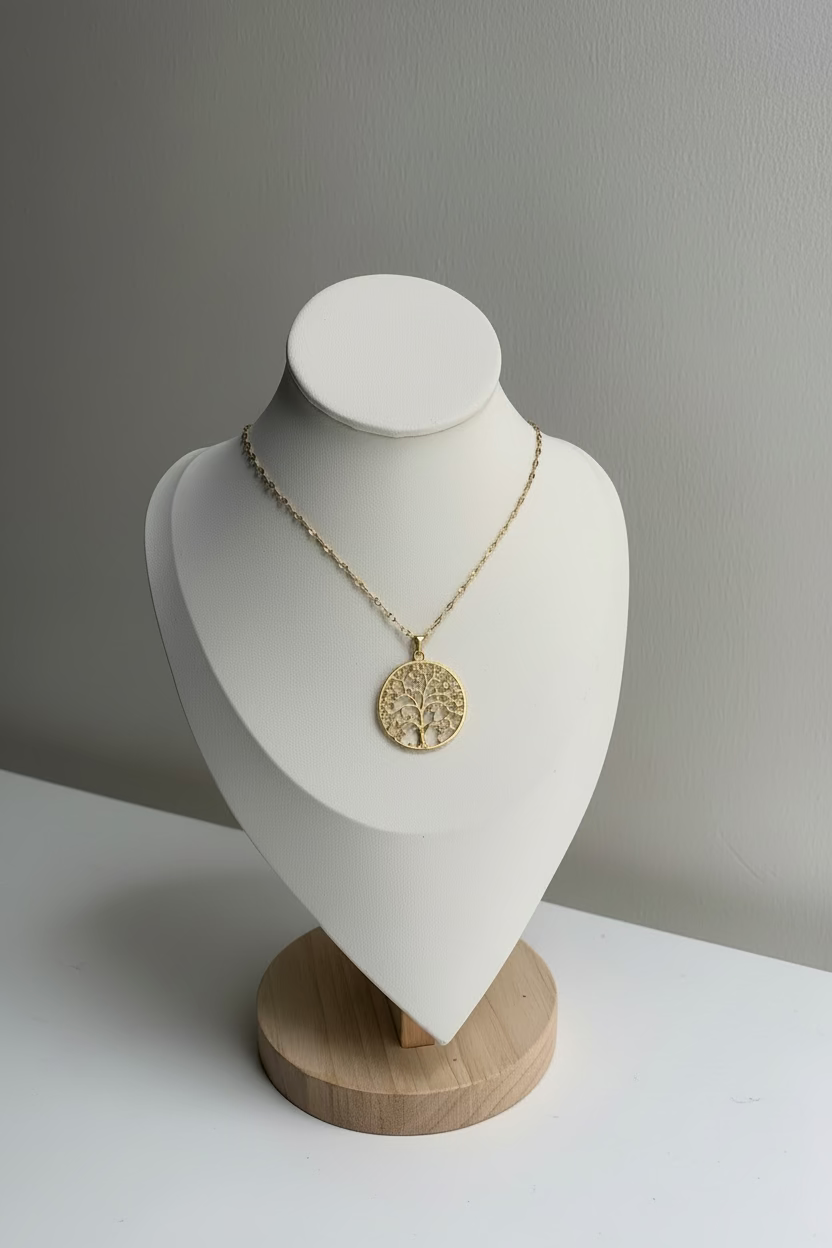 18k Gold necklace on a white mannequin bust against a gray background