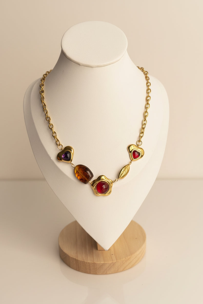 18 Gold Necklace with heart-shaped beads on a white bust